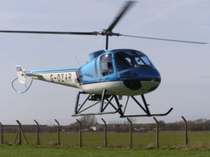 Enstrom 480, G-OZAR, lands at The Helicopter Museum