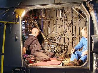Ray and Chris work in XM328 cabin